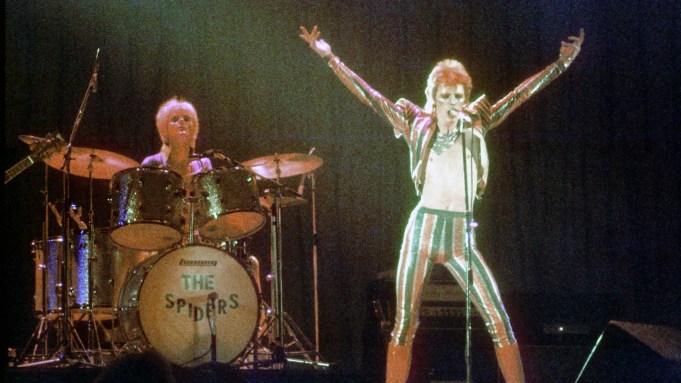 David Bowie performs onstage during his "Ziggy Stardust" era in 1973 in Los Angeles.